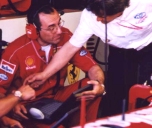 Ferrari engineers downloading information onto their laptops